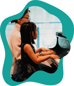 Group Piano Lessons where students enjoying a fun, tailored piano lesson in our New Westminster studio, serving all ages and levels.