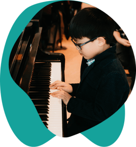 A student enjoying a fun, tailored piano lesson in our New Westminster studio, serving all ages and levels.