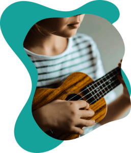 A beginner student building coordination and rhythm in a fun ukulele lesson near Burnaby.