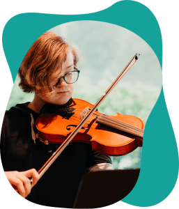 Violin student exploring classical and popular tunes using Suzuki and RCM methods near Surrey.